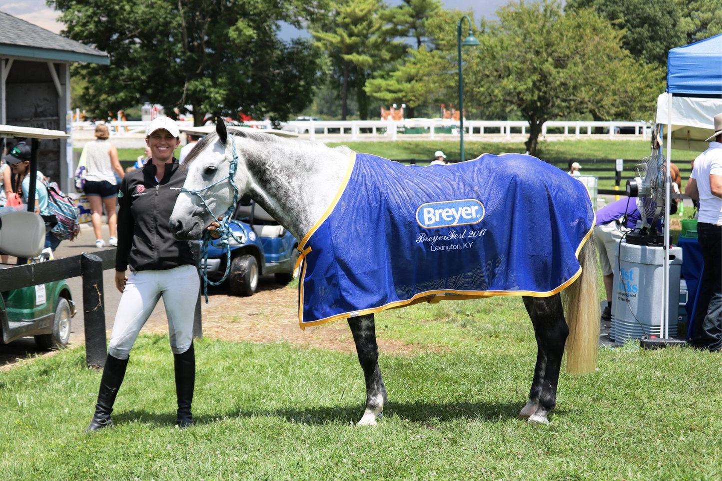 Elisa Wallace, 5 star eventer, posing with her horse after a show.