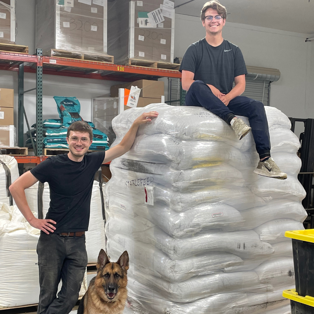 StableFeed Team posing with a pallet of chia.